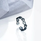 Ring med pote-design i sort