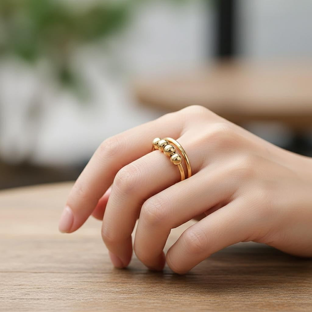 Prsten proti stresu s otáčivými perličkami 