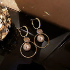 Perleøredobb med hengende perle