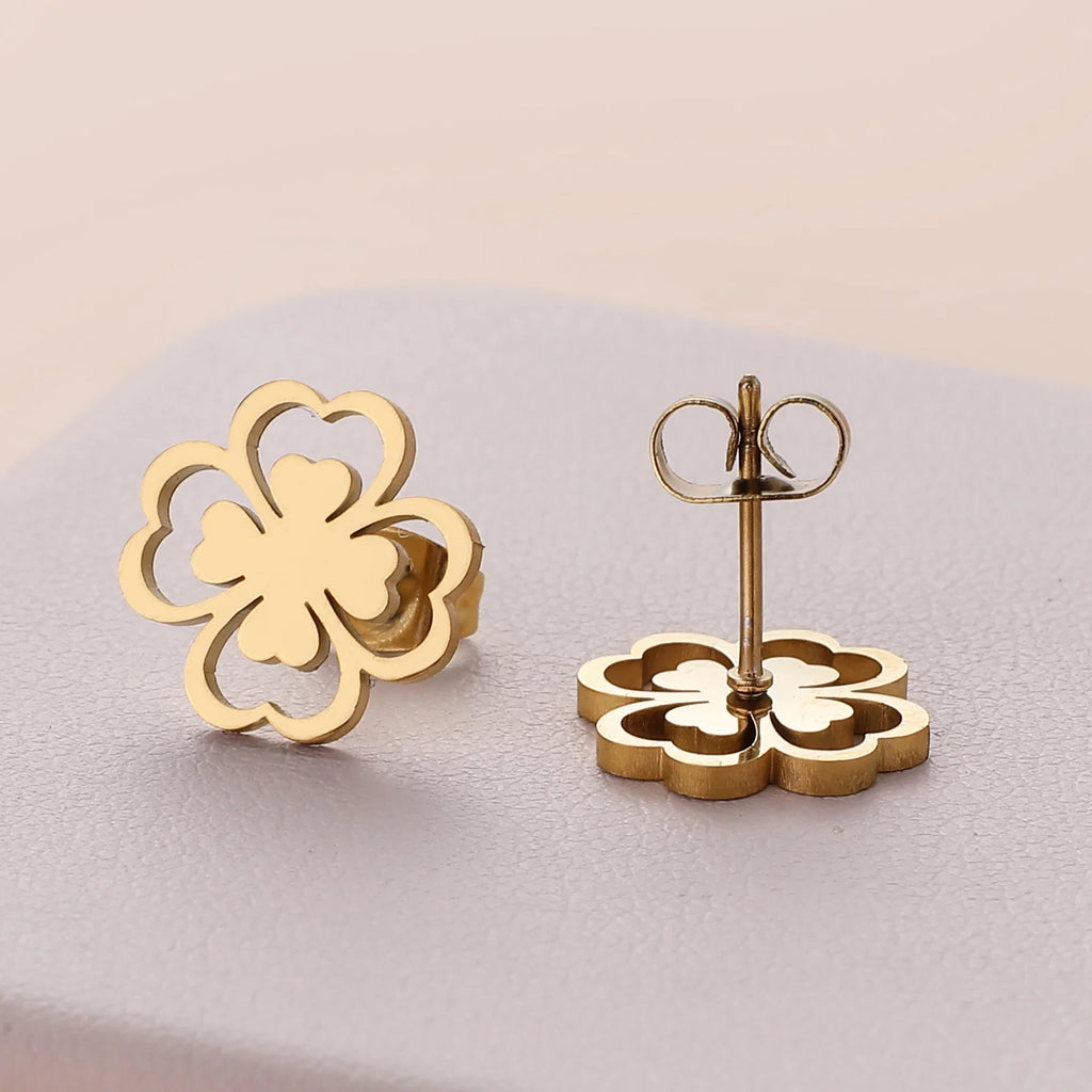 Øreringe i klips med firebladskløver i guld
