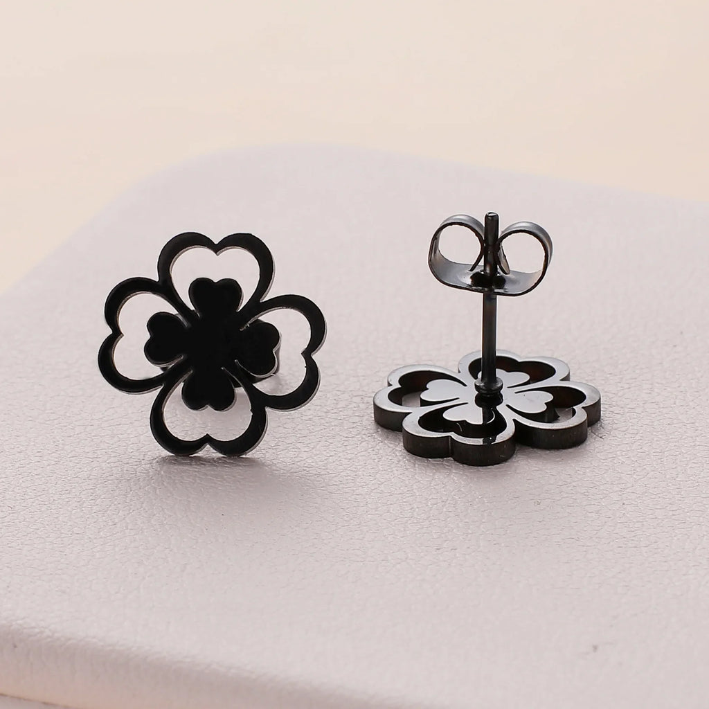 Øreringe i klips med firebladskløver i sort