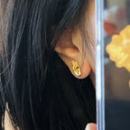 Øredobber med Buddhas hånd i gull