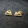 Minimalistiska bergörhängen i guld