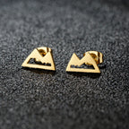 Minimalistiska bergörhängen i guld
