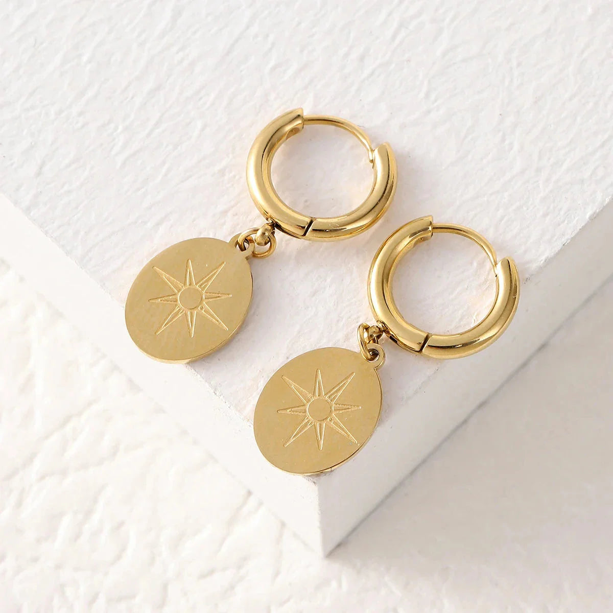 Øredobber med kompassanheng, vindrose