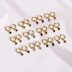 Creol-øreringe med zirkon fødselssten