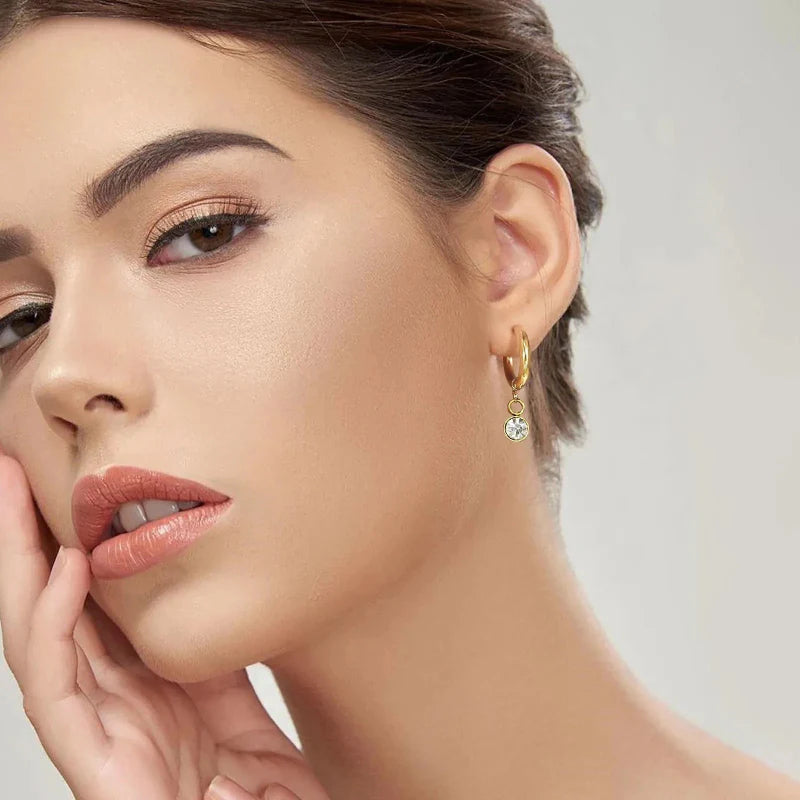 Creol-øreringe med zirkon fødselssten