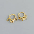 Creoler med hængende stjerner og måner i guld