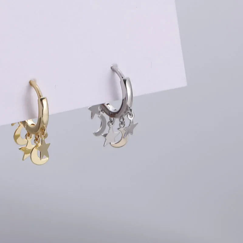 Creoler med hængende stjerner og måner i sølv