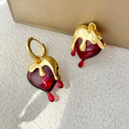 Náušnice kruhy s taviacím srdcem ze zlata