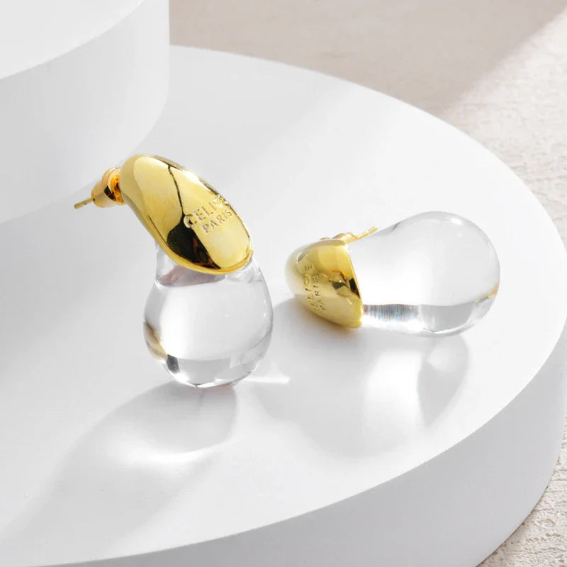 Ørestikker med gennemsigtig dråbeformet guld