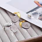 Ørestikker med gennemsigtig dråbeformet guld