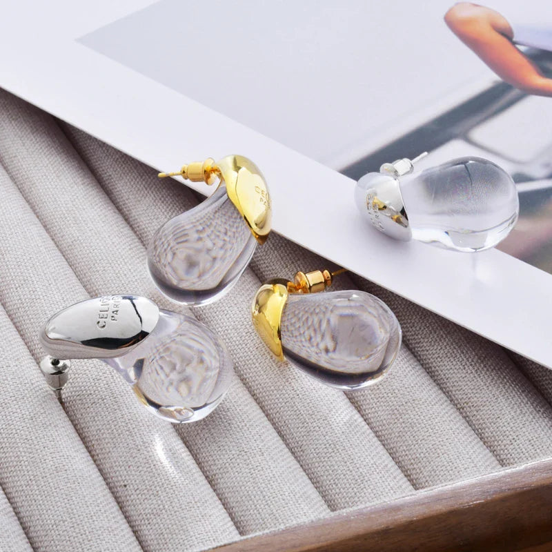 Ørestikker med gennemsigtig dråbeformet guld