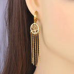 Hængende øreringe med livets træ i guld