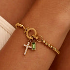 Armband med kors och december månadssten
