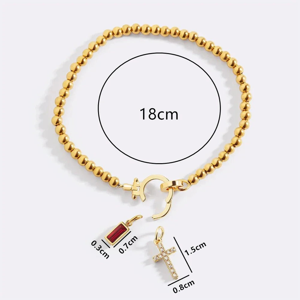 Armband med kors och månadssten