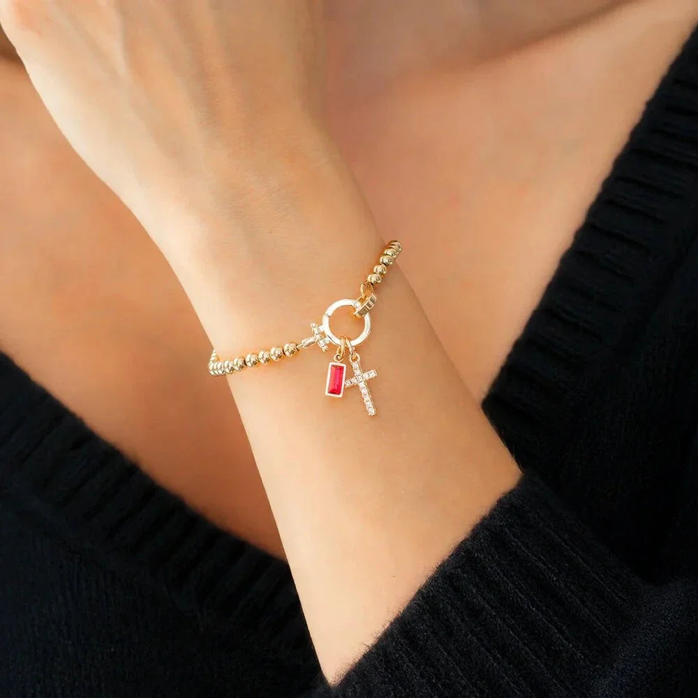 Armband med kors och månadssten