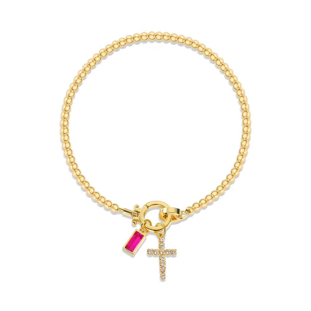 Armbånd med kors og fødselsstein
