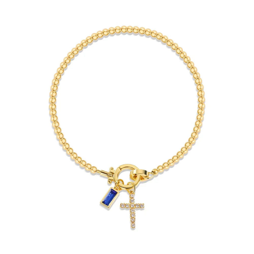Armbånd med kors og fødselsstein