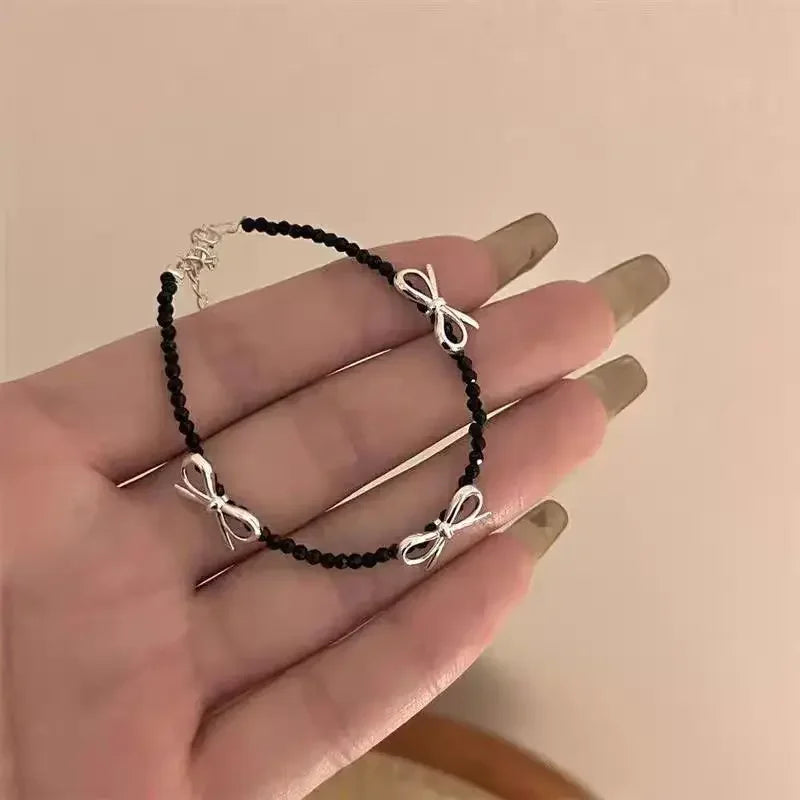 Armbånd med sløyfe til dame i svart