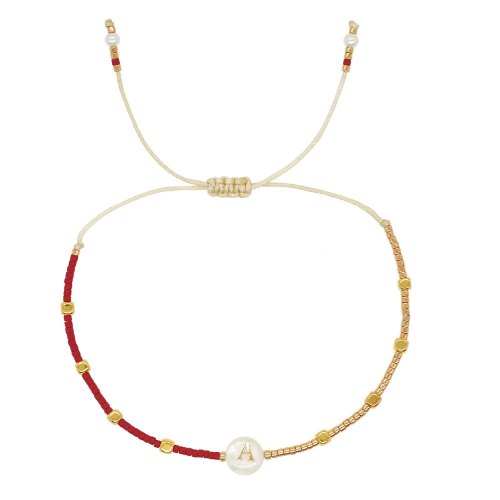 Tvåfärgat armband initial a