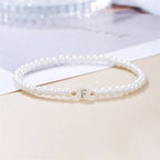 Hvidt armbånd med initial f