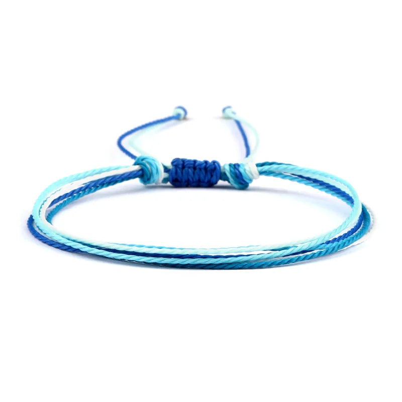 Handgjort blått brasilianskt armband i vitt och blått
