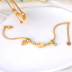 Beskyttelsesarmbånd med Fatmas hånd og blått øye gull