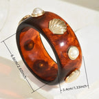 Armbånd i resin med skjell