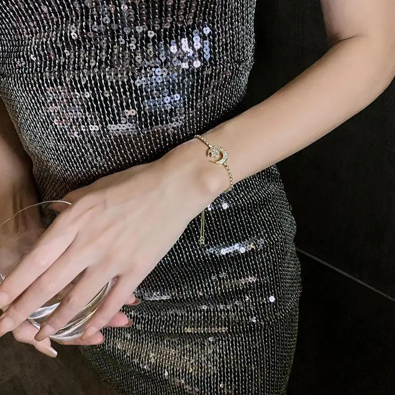 Armbånd med stjerne og måne i rhinsten