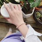 Armbånd med rosa perler