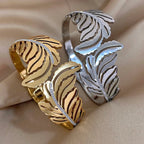 Bredt armbånd med palmeblad i sølv