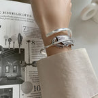 Fjäderarmband i silverfärg för dam