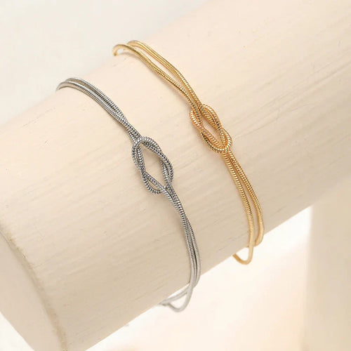 Armbånd til par med sammenflettede knuder i guld og sølv (Sæt med 2 armbånd)