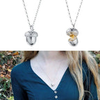 Halskjede med duskvedheng med hjerte