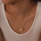 Halskæde med vedhæng af bjerg og måne