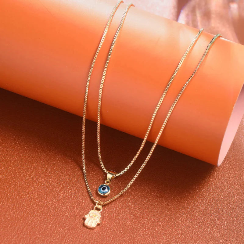 Collier Double avec Pendentif Oeil Bleu Turc et Main de Fatma or