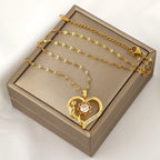 Halskæde vedhæng med hjerte og roterende blomst mod stress