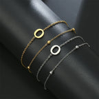 Armband med dubbel initial i guld och silver  o