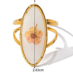 Velký prsten s květinou v průhledném rámečku