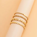 Sæt med 4 guld stjerne armbånd